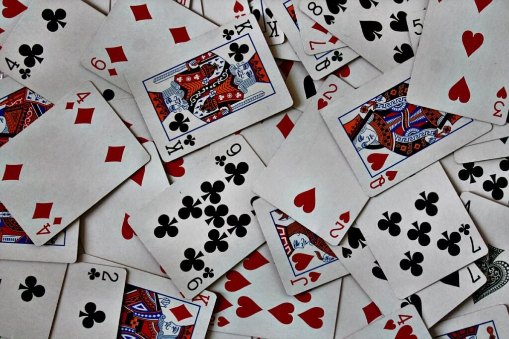 12 Best 2 Player Card Games for Couples (Easy Rules for Date Night) 2 Pile of playing cards on a table ready for a two player game