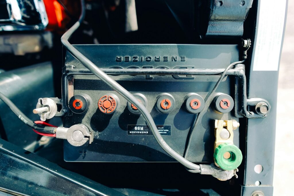 Clicking Noise When Trying to Start Car? 7 Causes and How to Fix Them 2 Close-up of a car battery with cables connected to the terminals