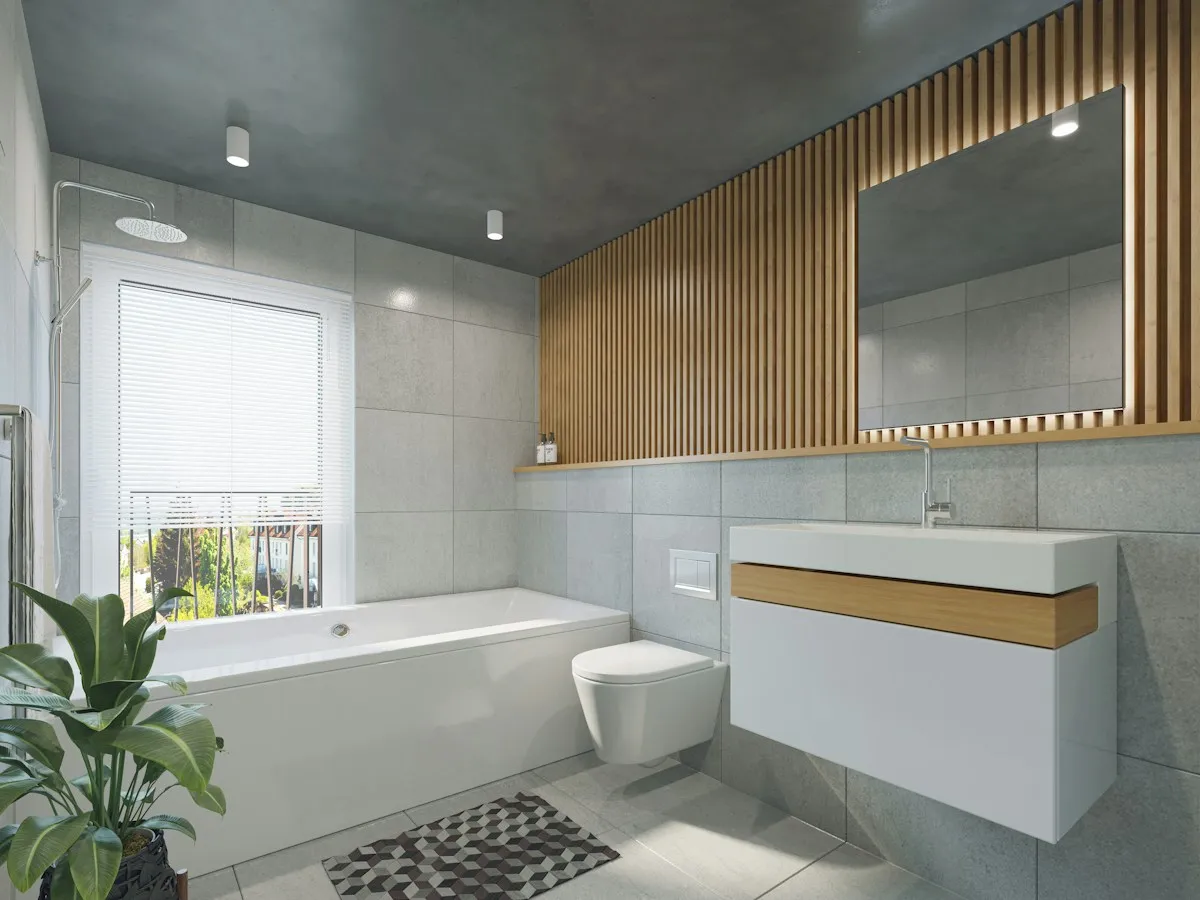 Finished modern bathroom with a neatly caulked bathtub and tiled walls
