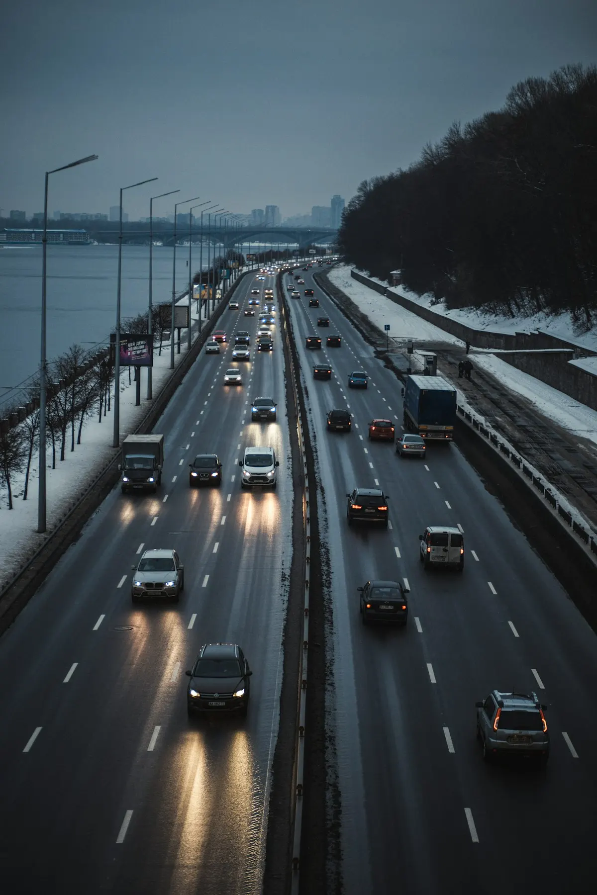 How Many Miles Is Too Many for a Used Car? A Realistic Buyer's Guide 3 Cars driving on a busy multi-lane highway, comparing highway miles and city miles