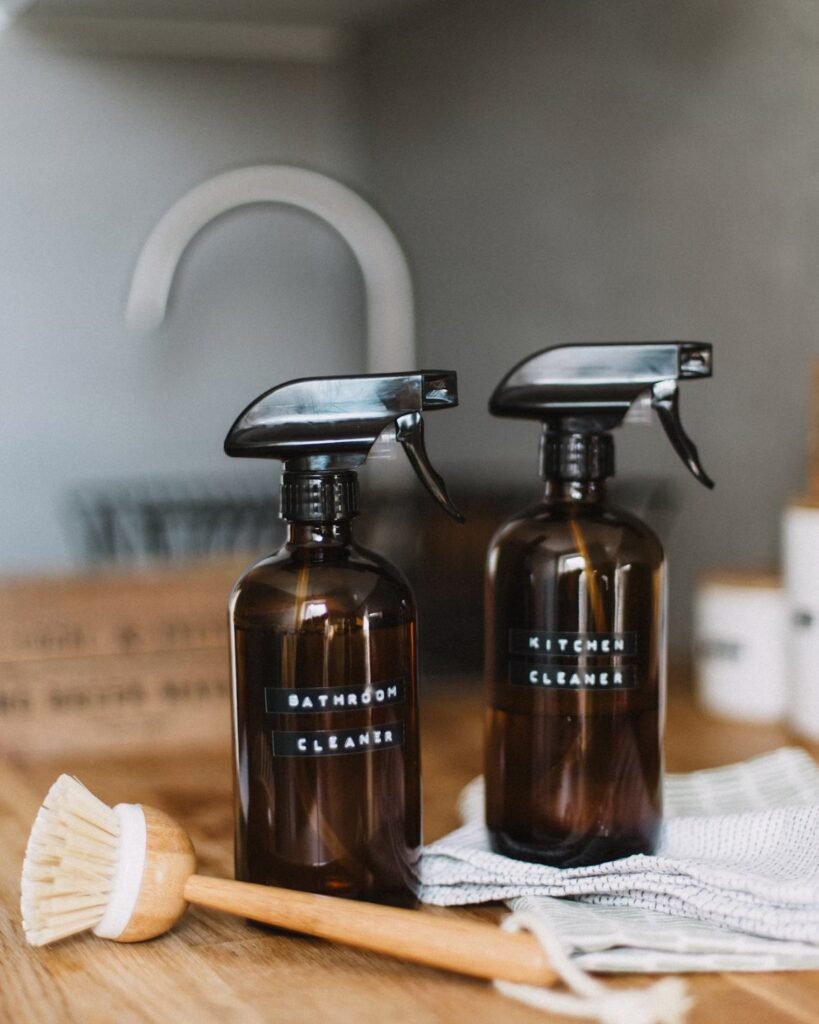 Two spray bottles of homemade cleaner for glass shower doors