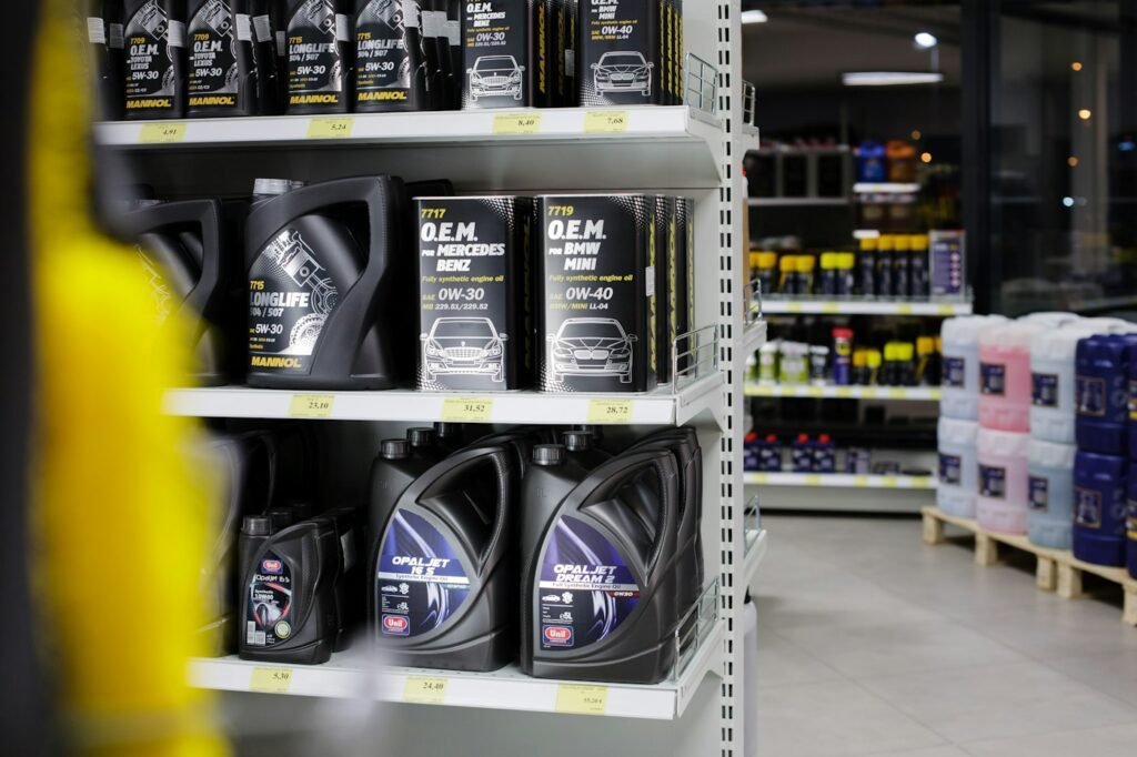 How to Check Oil Level in Your Car: A 5-Minute Beginner's Guide 5 Bottle of motor oil ready to top up a car engine