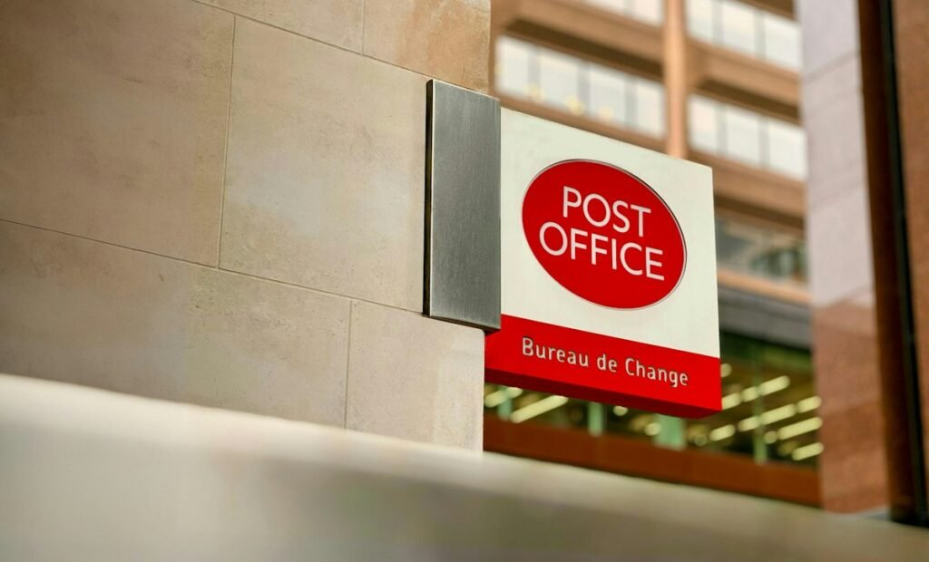 How to Fill Out a Money Order: Step-by-Step Guide (With Examples) 3 Post office building sign where you can buy a money order