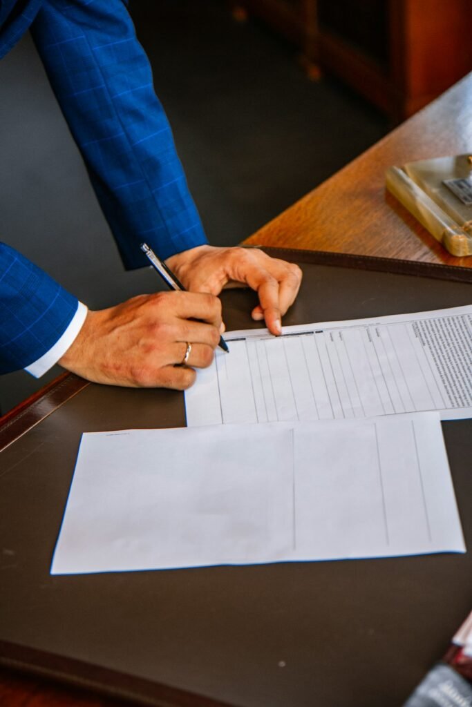 How to Fill Out a Money Order: Step-by-Step Guide (With Examples) 4 Person filling out a money order form with a pen