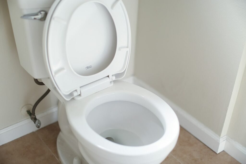 White ceramic toilet with the lid closed in a clean modern bathroom