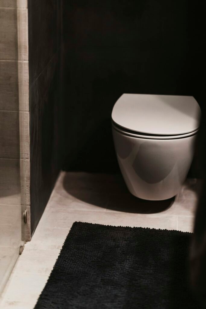 Quiet bathroom with a toilet that has stopped running after a successful fix