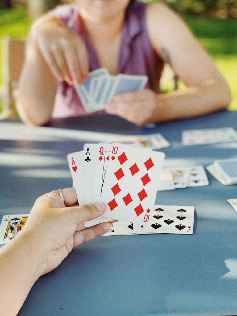 Person quickly placing a card during a competitive round of Speed