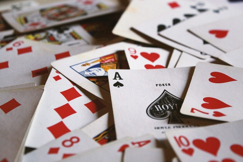 Playing cards scattered on a table after a fast game of Speed