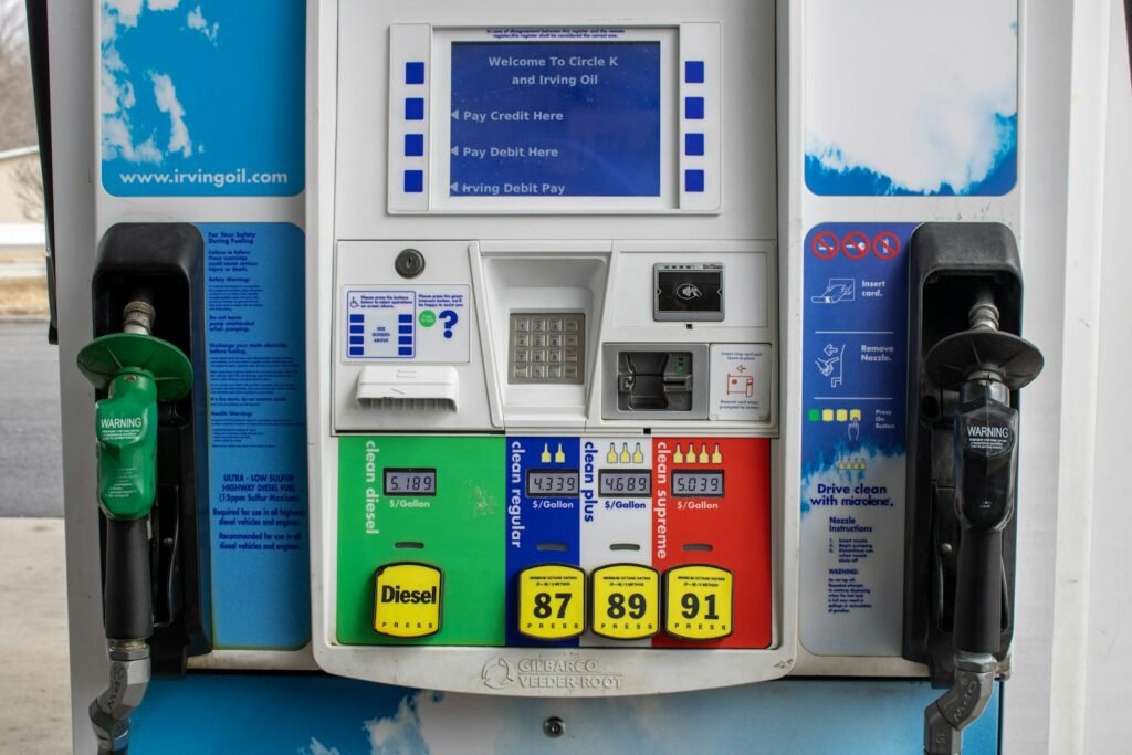 Close-up of a gas pump display showing fuel prices and grades