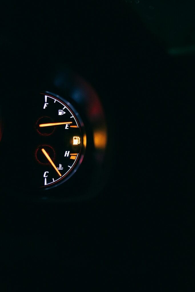 Car instrument cluster with gauges glowing at night