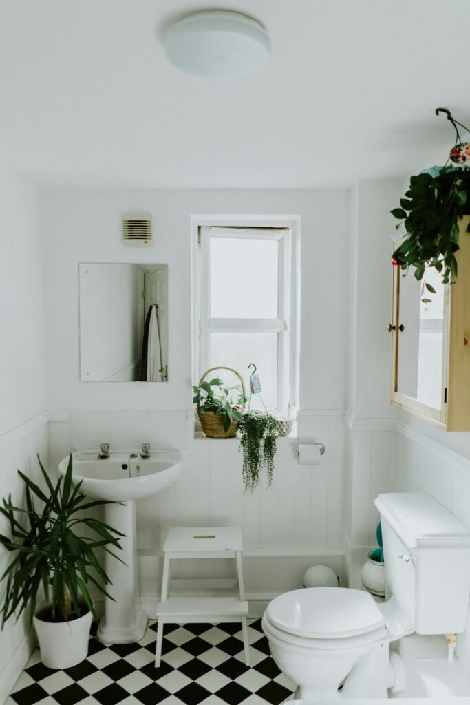 How to Unclog a Toilet Without a Plunger: 7 Easy Methods That Work 3 Bright bathroom with a toilet and pedestal sink