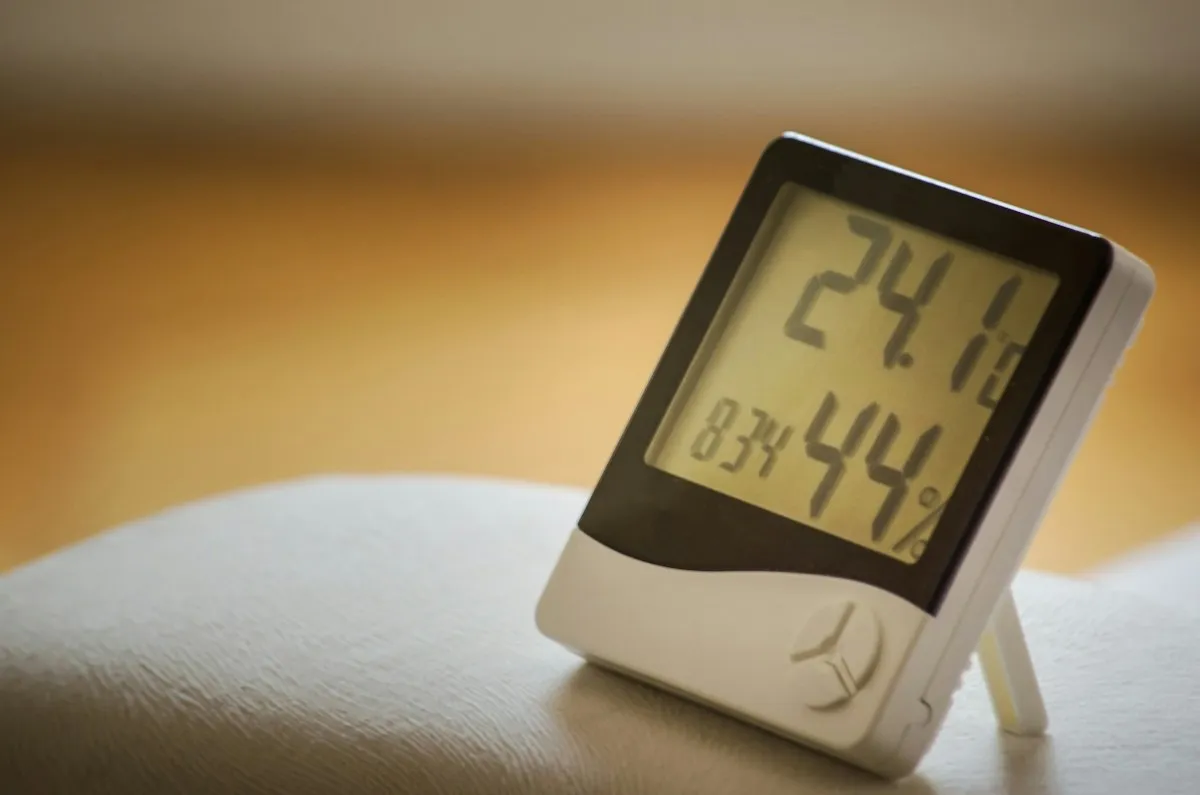 Digital hygrometer showing indoor humidity level to help stop musty odors
