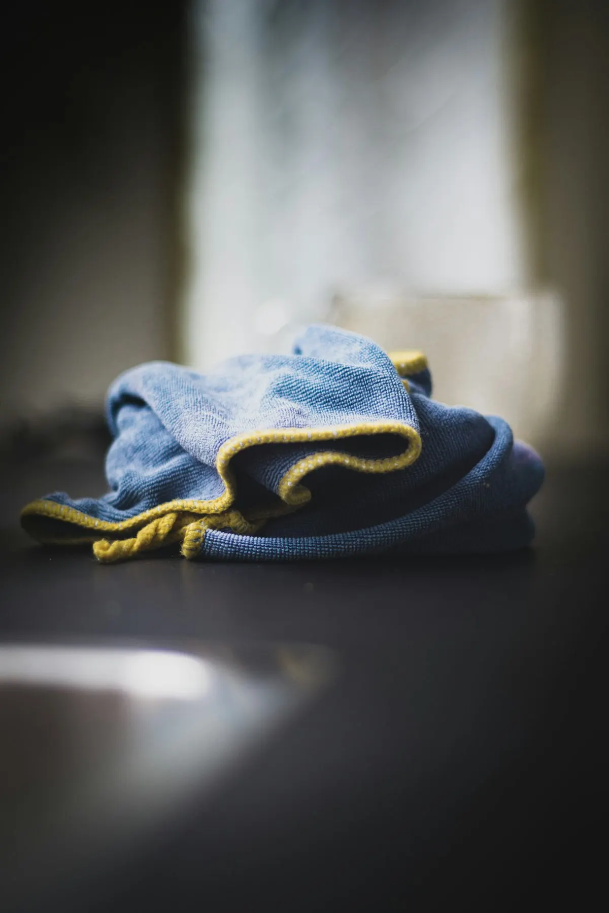 Stack of microfiber cloths used to clean and dry baseboards