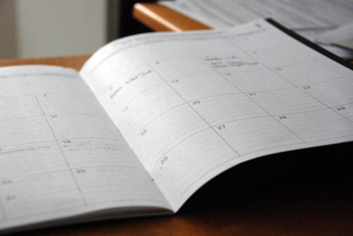 Open monthly planner on a desk used to track no-spend days