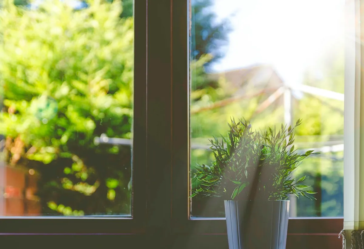 Open window letting in fresh air to ventilate the house and keep musty smells away