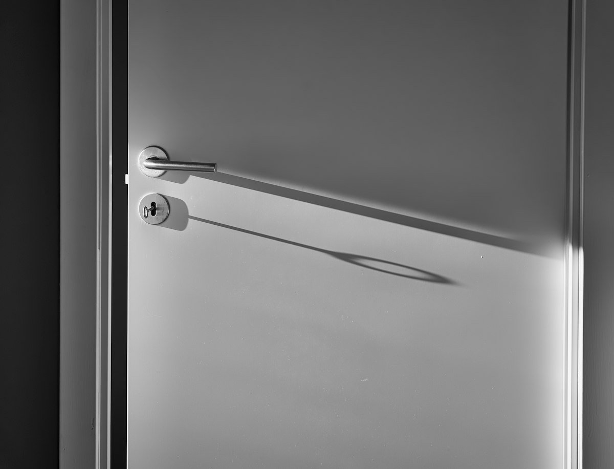 White interior door with a silver lever handle