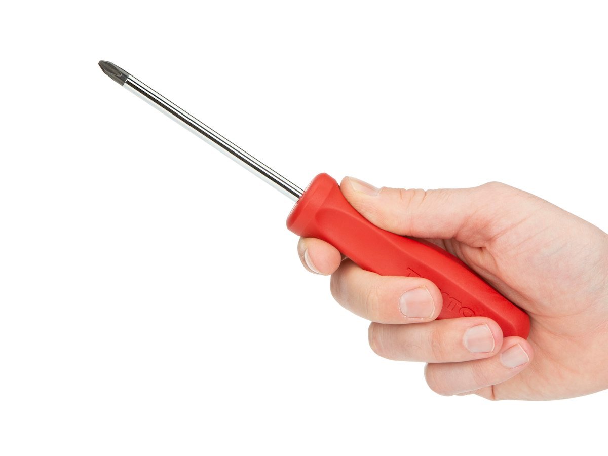Person holding a red and silver screwdriver
