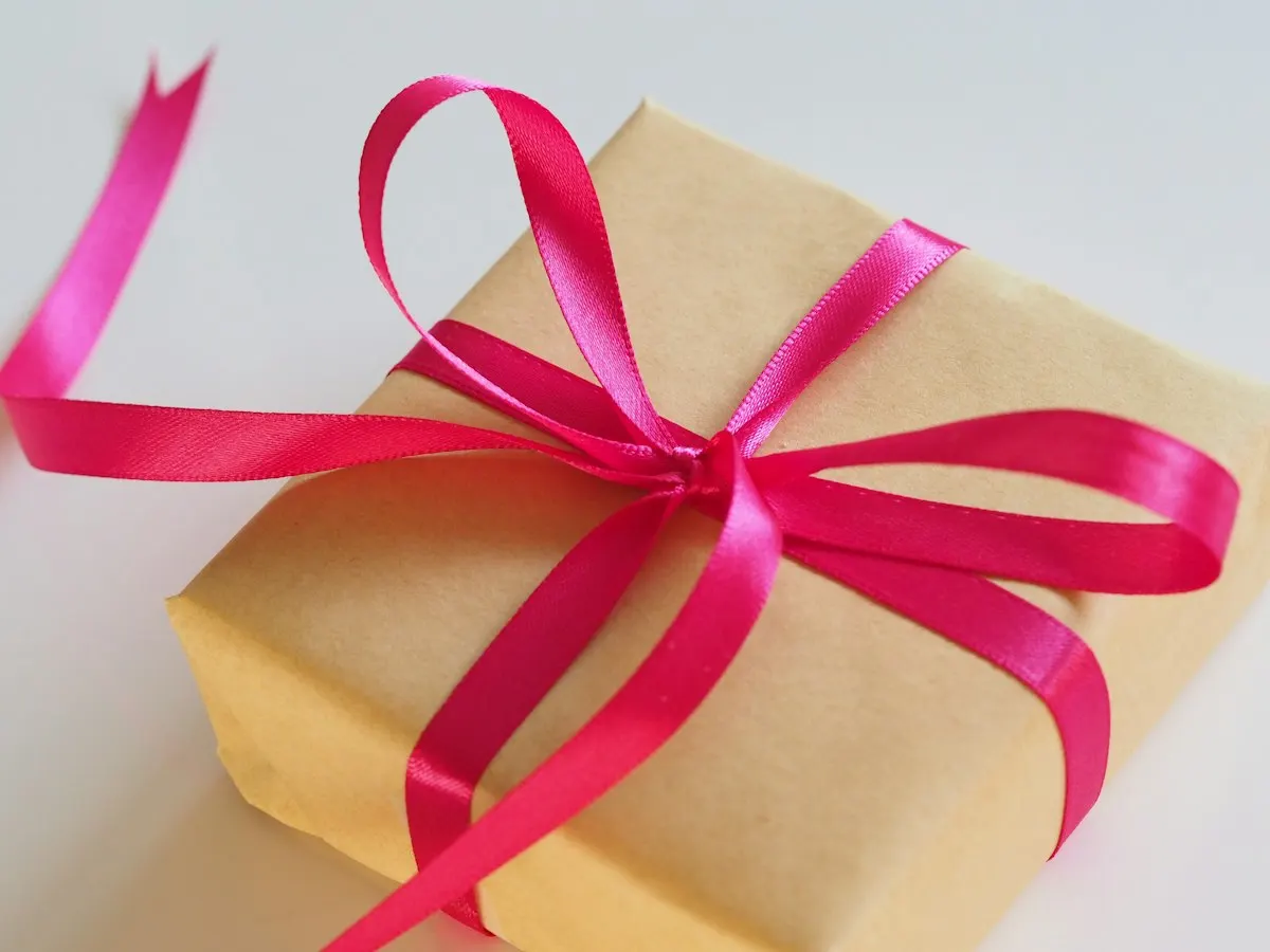 Gift wrapped with pink ribbon as a white elephant gift idea