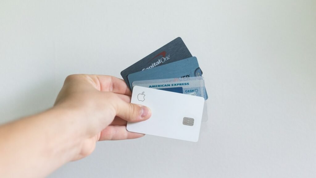 Hand holding several credit cards